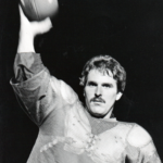 Charlie Bliss throwing football in practice jersey