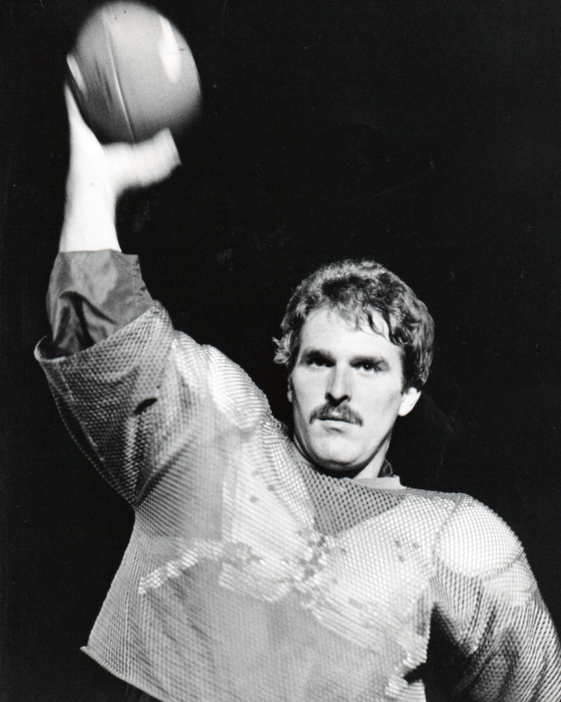 Charlie Bliss throwing football in practice jersey